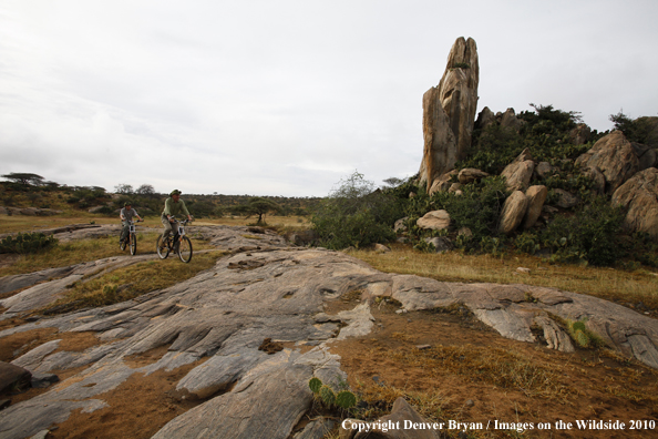 Family mountain biking on african safari