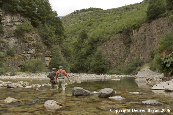 Flyfishermen walking up river.