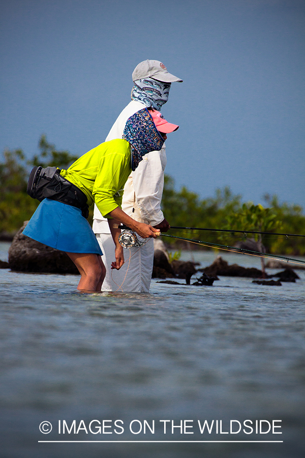 Flyfishing woman in flats.