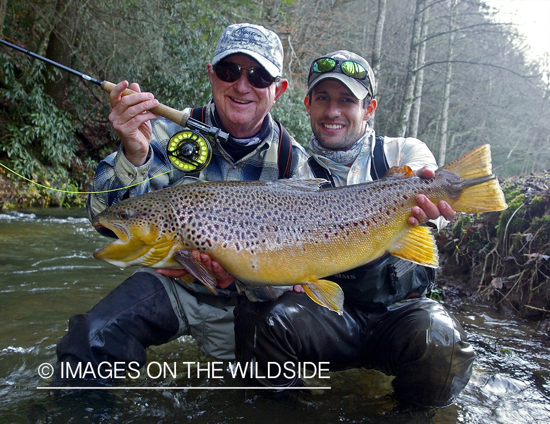 Flyfisherman with brown trout.