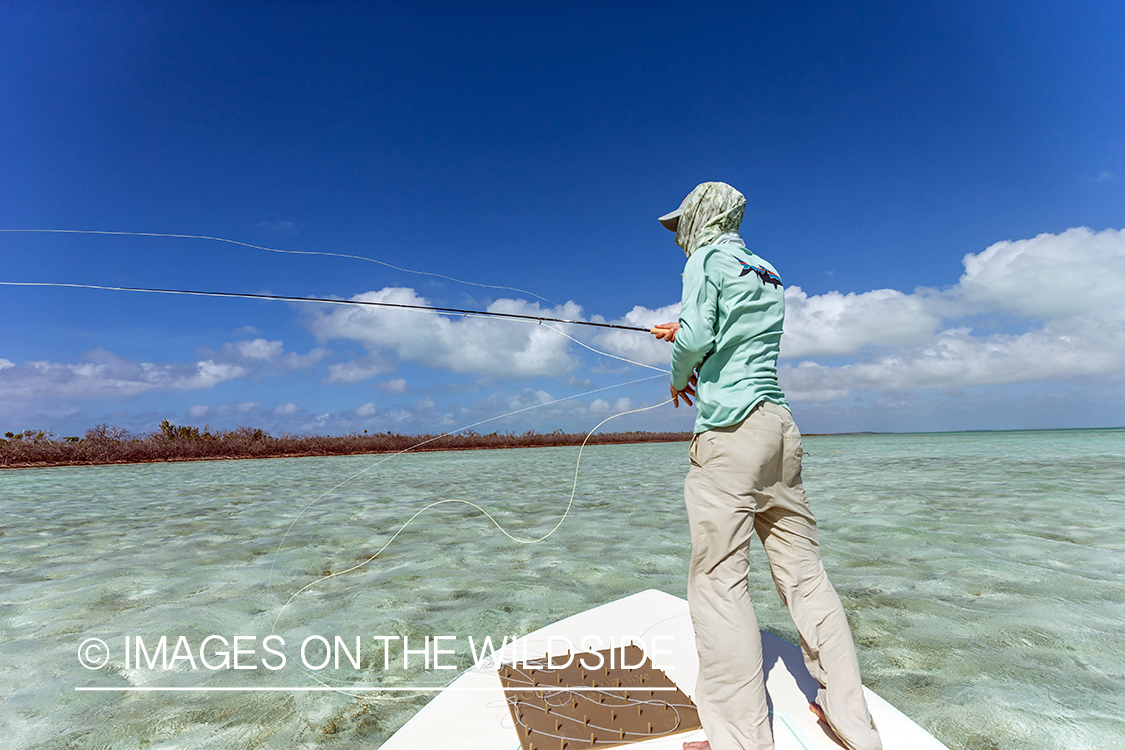 Saltwater flyfisherman casting from boat.