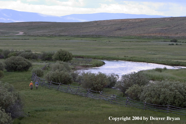 Flyfishermen walking to/from river.