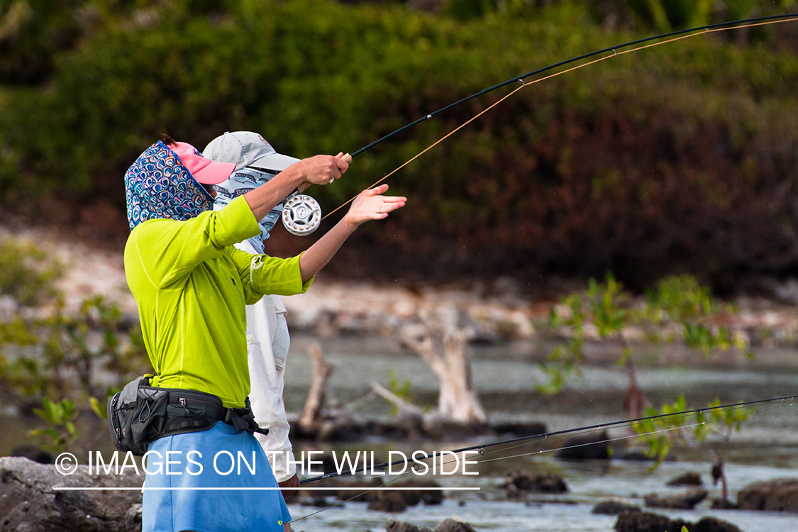 Flyfishing woman in flats.