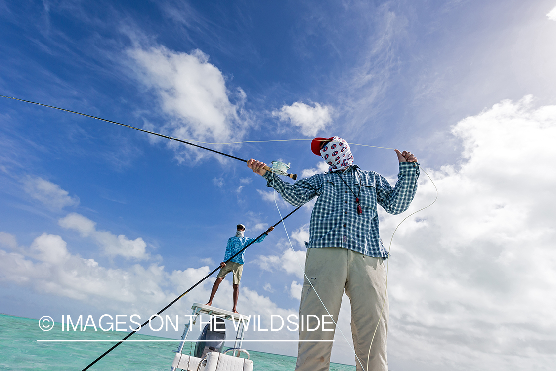 Saltwater flyfisherman casting from boat.