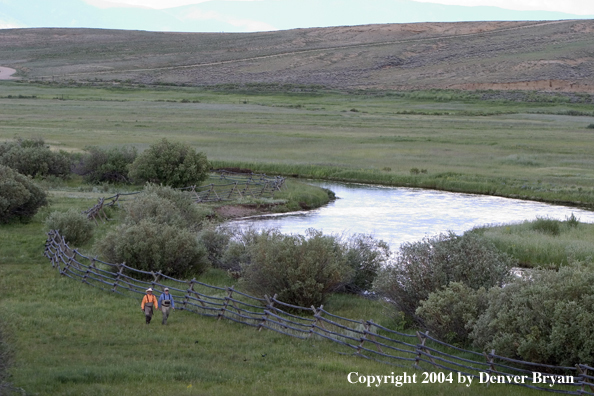 Flyfishermen walking to/from river.