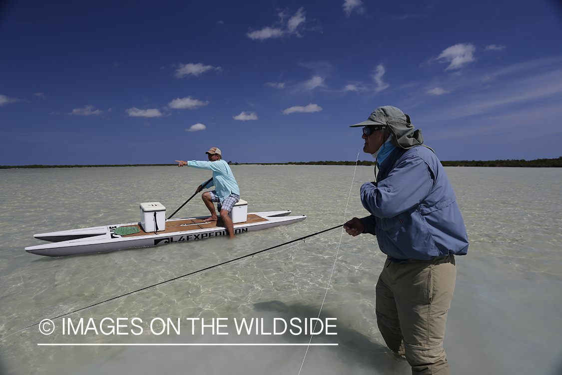 Saltwater flyfisherman fighting fish.