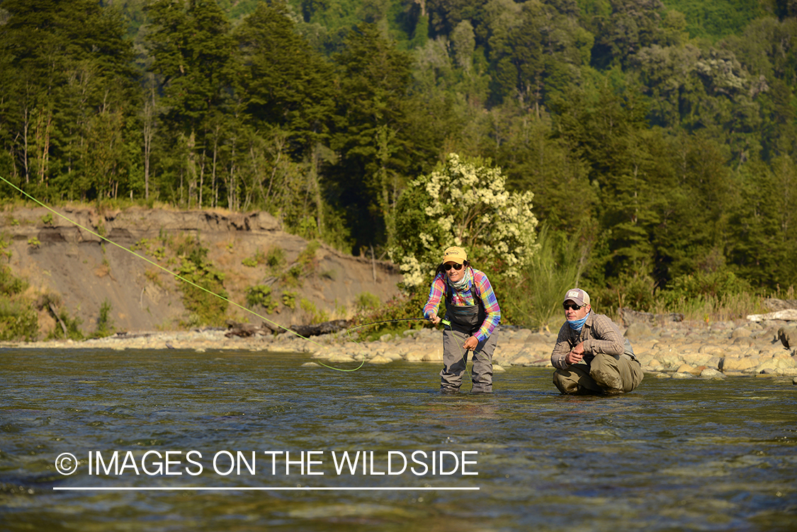 Flyfishermen on river in Chile.