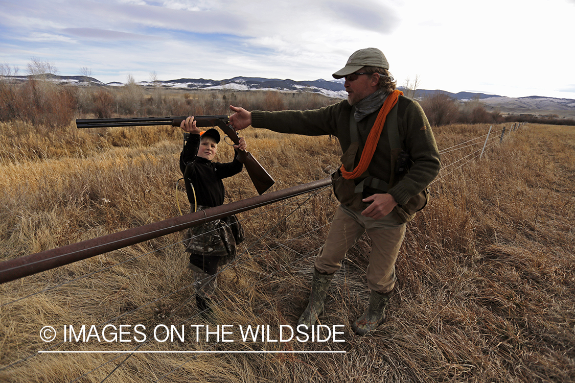 Father and son pheasant hunting.