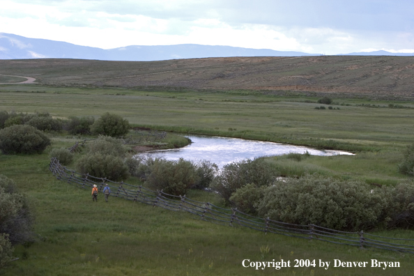 Flyfishermen walking to/from river.