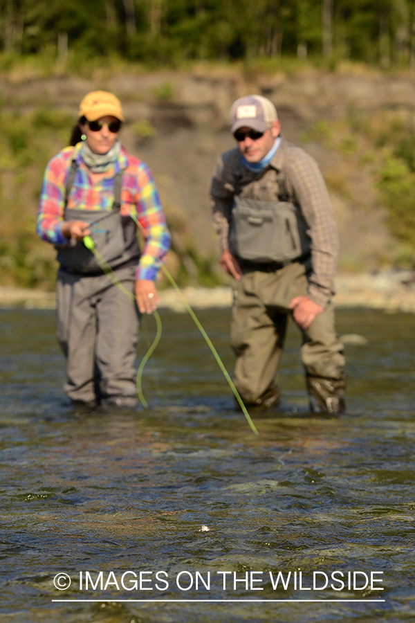 Flyfishermen on river in Chile.