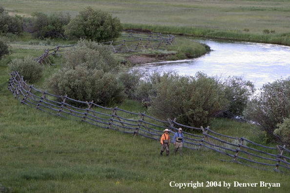 Flyfishermen walking to/from river.