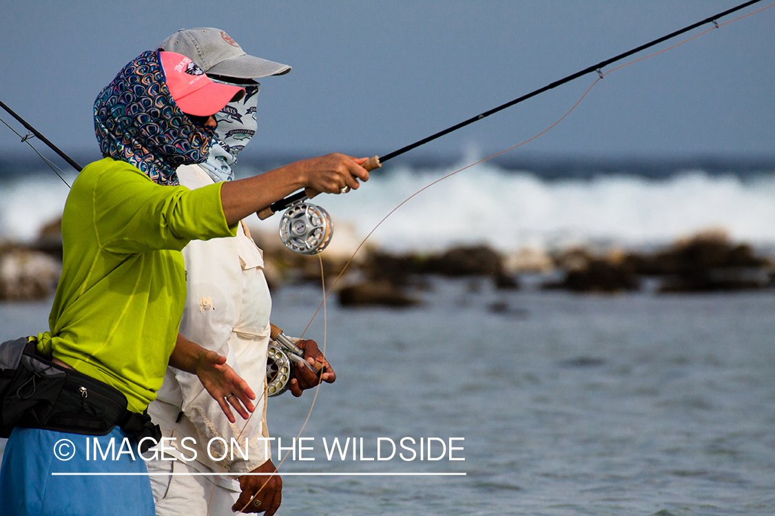 Flyfishing woman in flats.