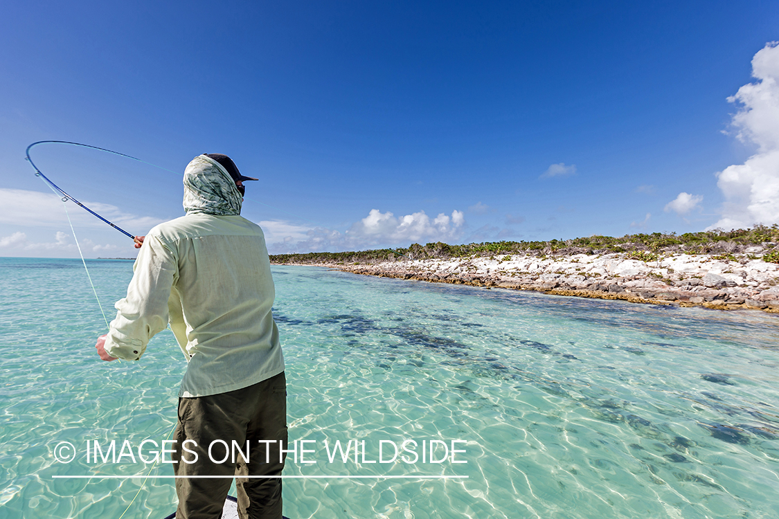 Saltwater flyfisherman casting from boat.