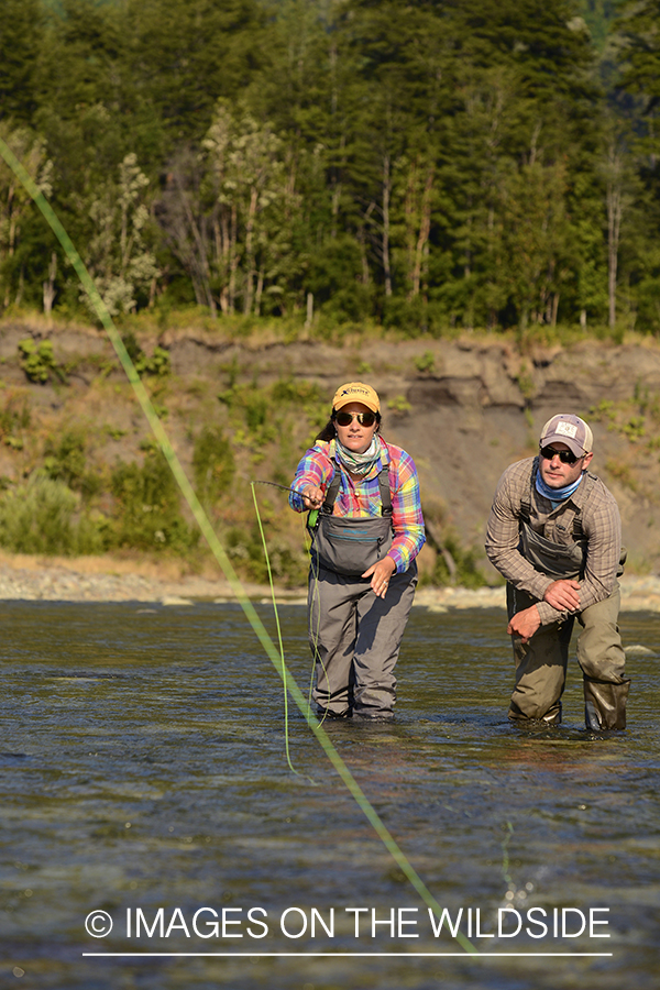 Flyfishermen on river in Chile.