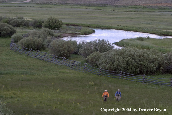 Flyfishermen walking to/from river.