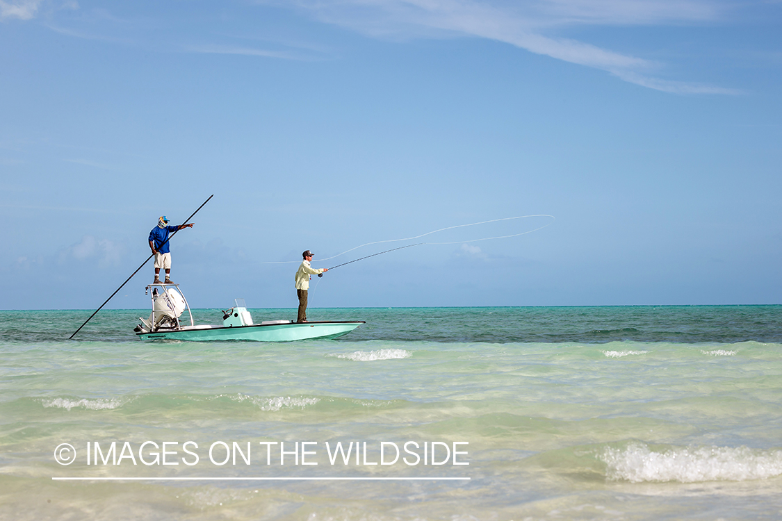 Saltwater flyfisherman casting from boat.