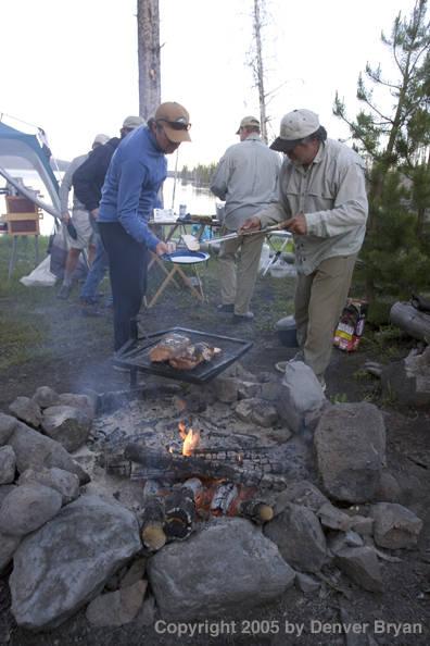 Flyfishermen at lakeside fishing camp.