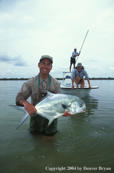 Saltwater flyfisherman holding permit.