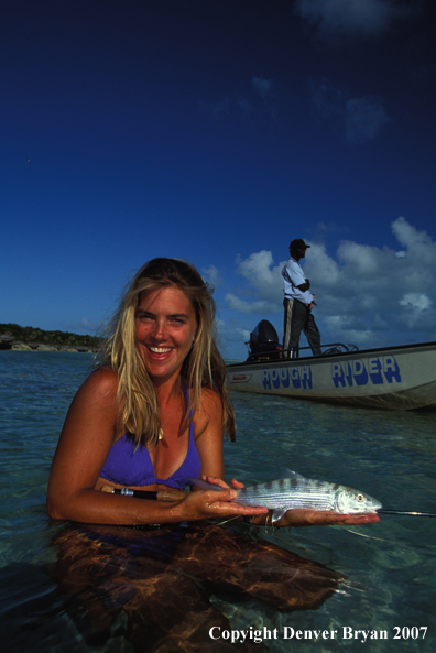 Saltwater flyfisher holding bonefish.