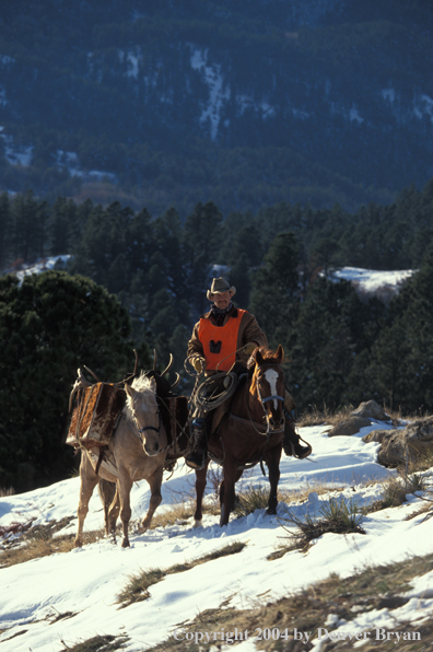 Big game hunter on horseback.