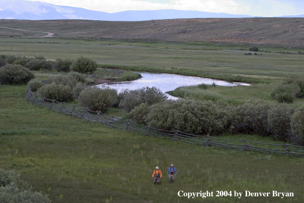 Flyfishermen walking to/from river.