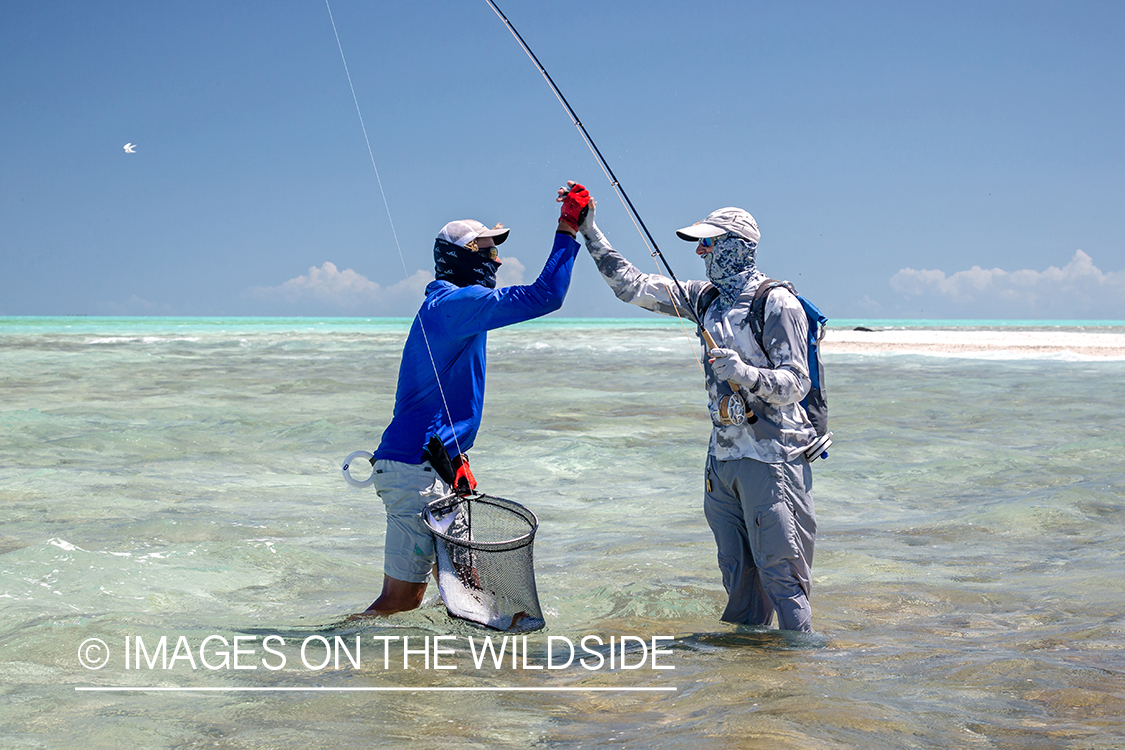 Flyfisherman celebrating.