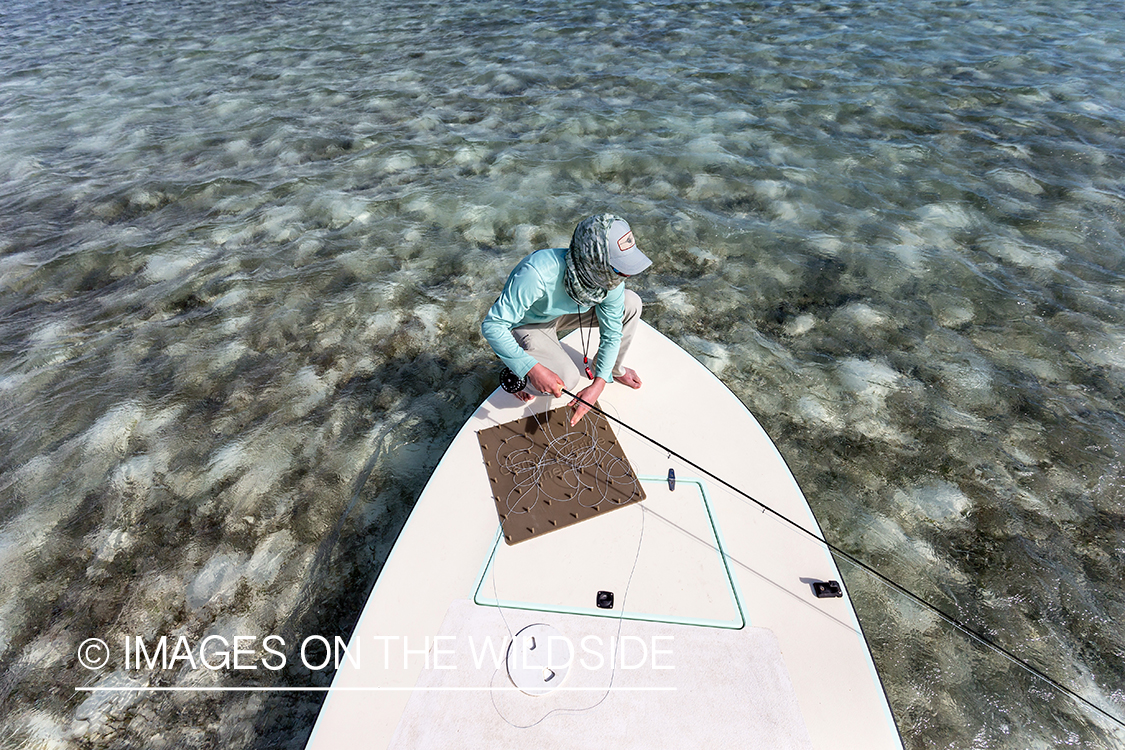 Flyfisherman on boat.