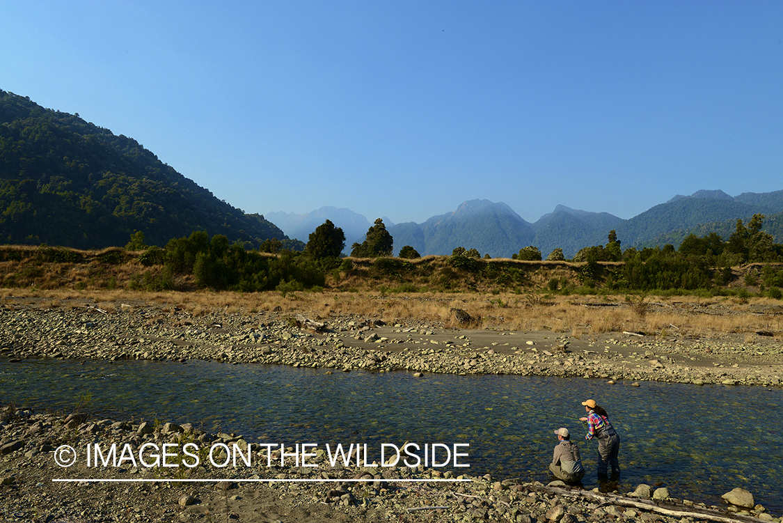 Flyfishermen on river in Chile.