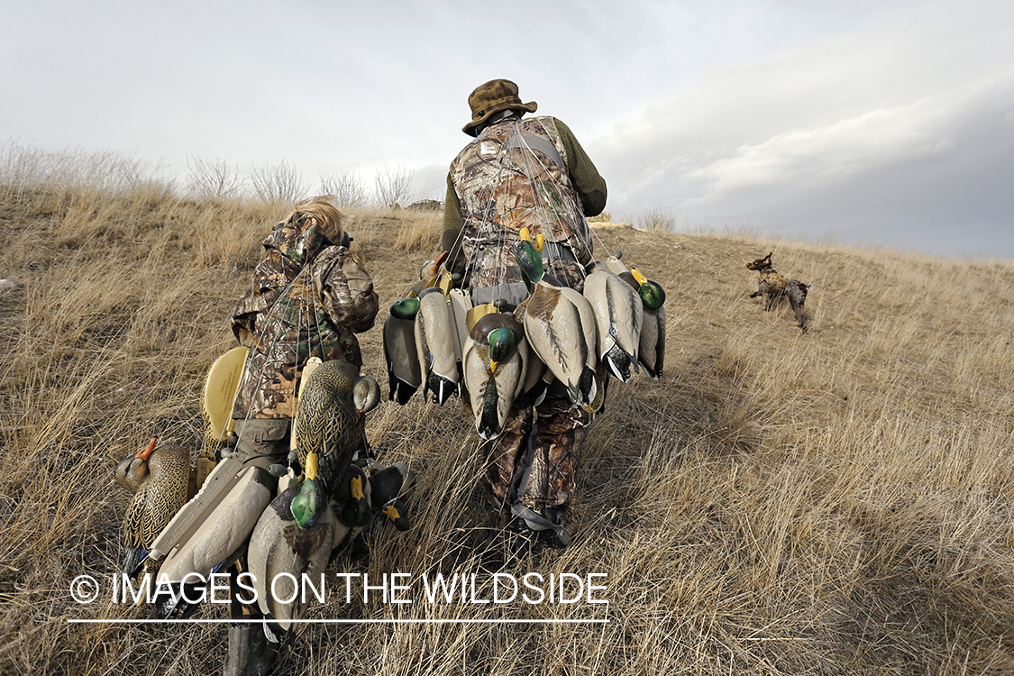 Father and son with bagged waterfowl.