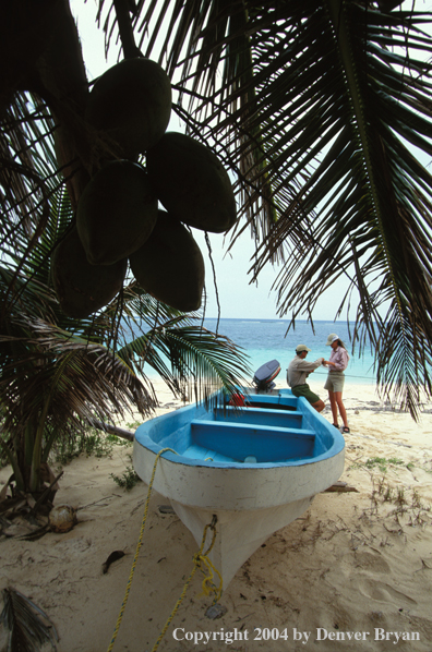 Saltwater flyfishing couple checking gear.