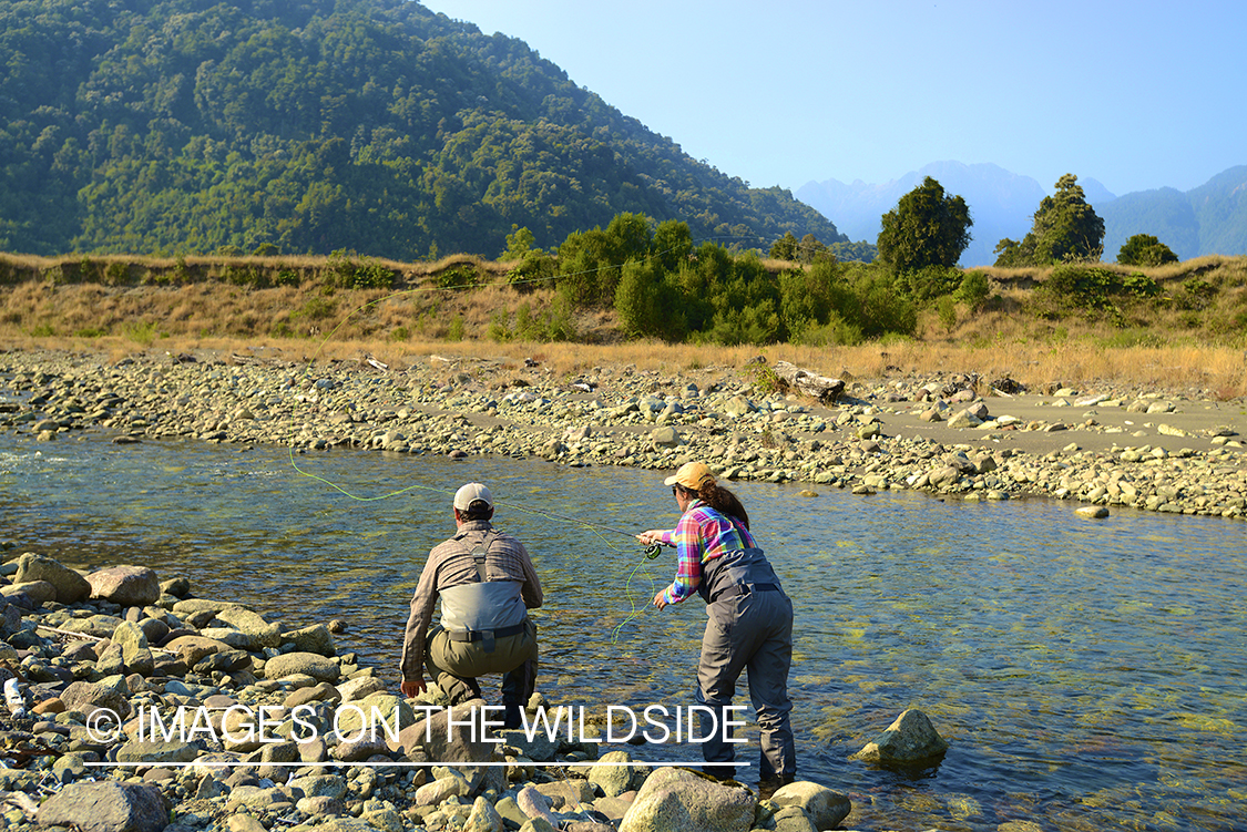 Flyfishermen on river in Chile.