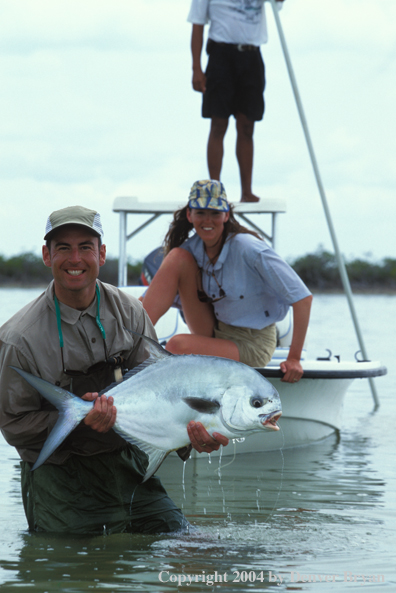 Saltwater flyfisherman holding permit.