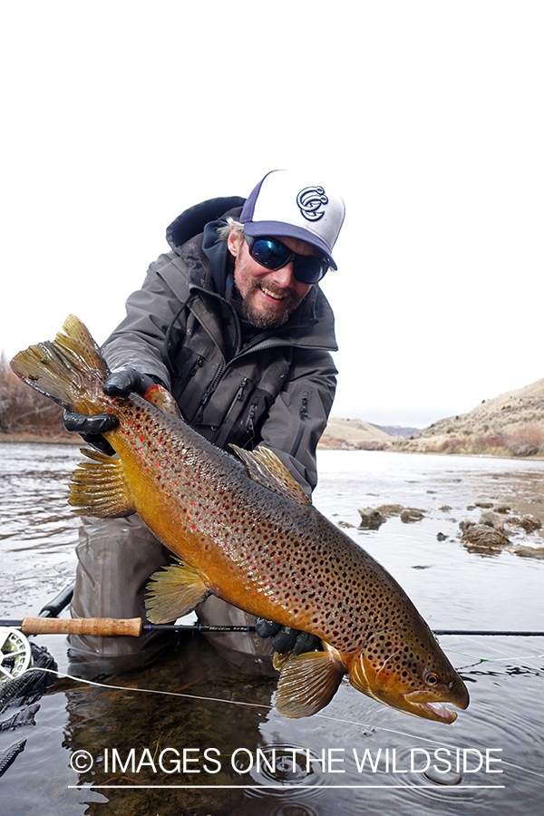 Flyfisherman with brown trout.