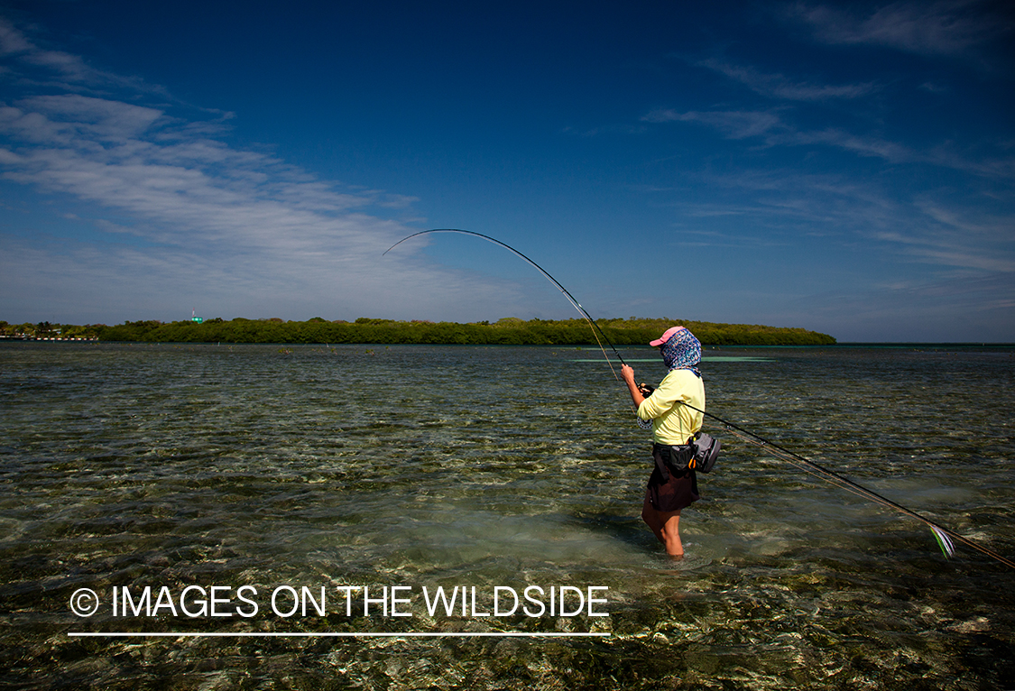 Flyfishing woman in flats.