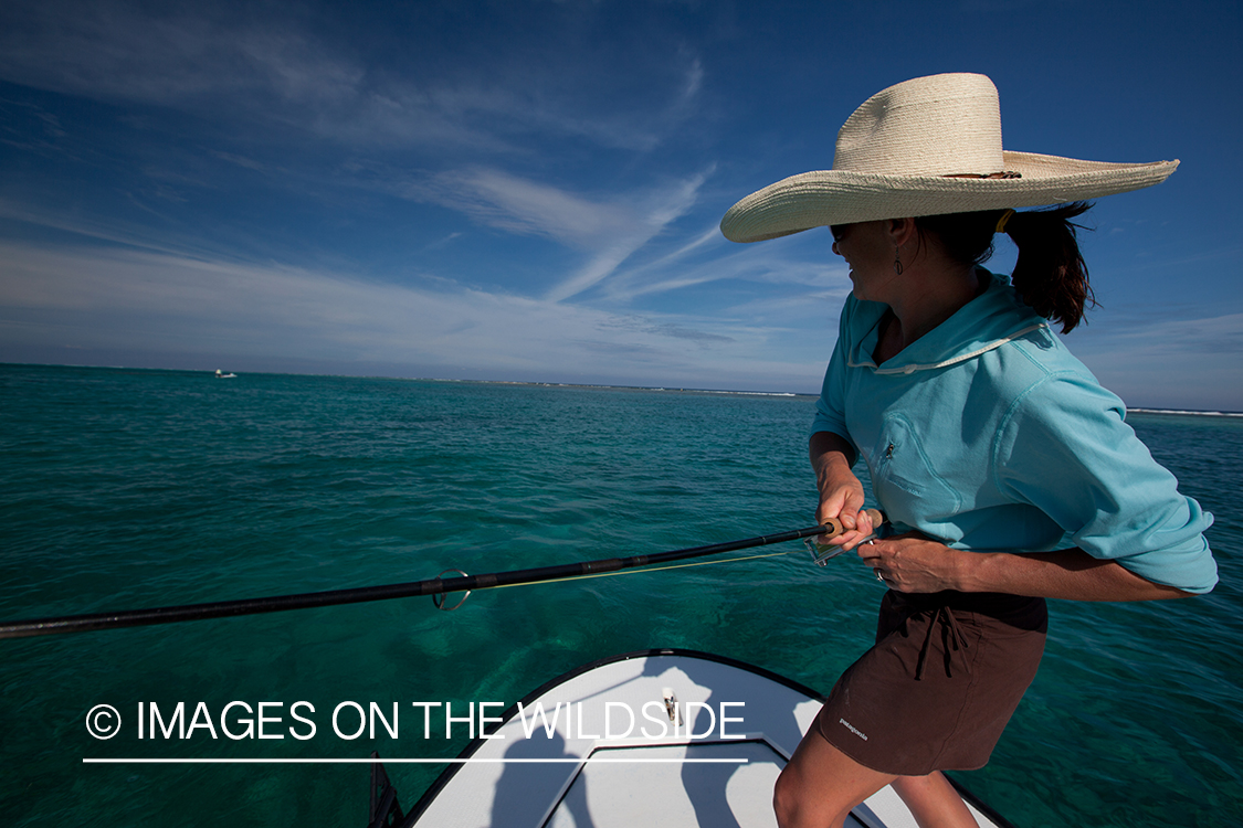 Flyfishing woman in flats.