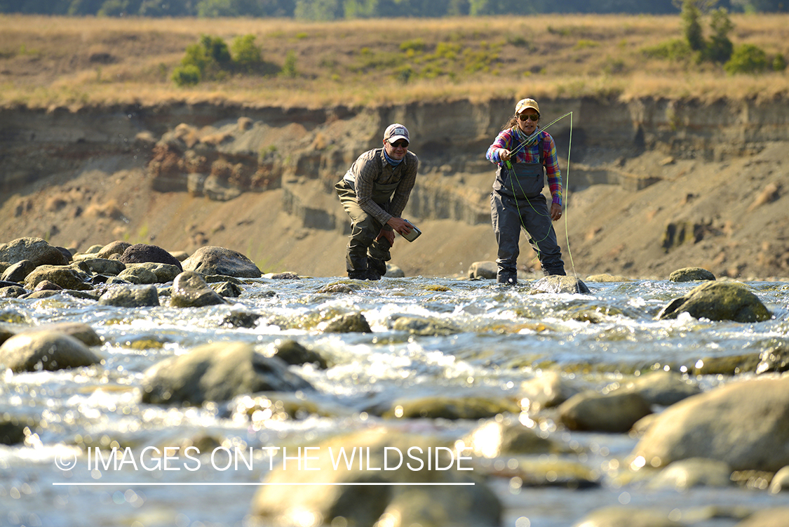 Flyfishermen on river in Chile.