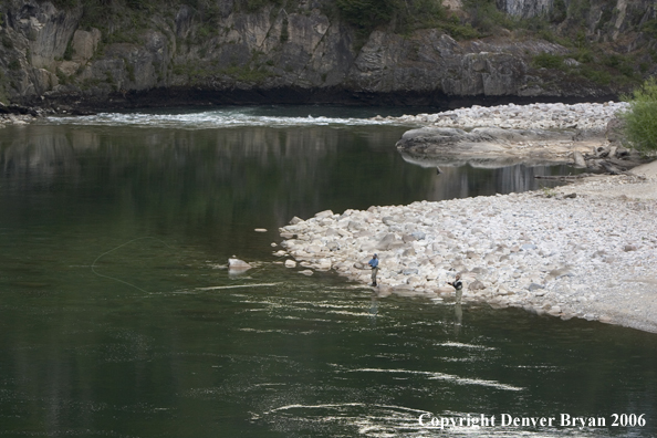 Flyfishermen casting from shore.