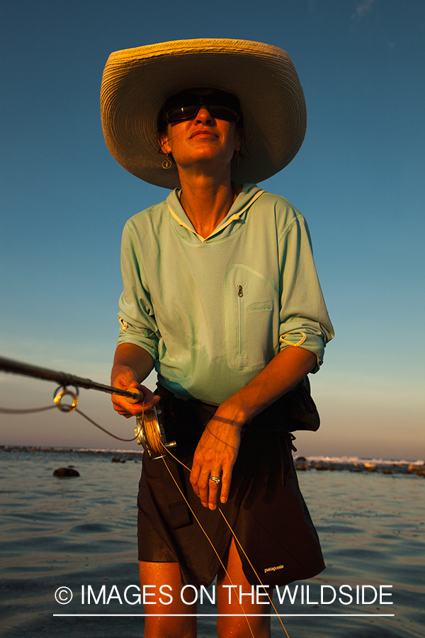 Flyfishing woman in flats.