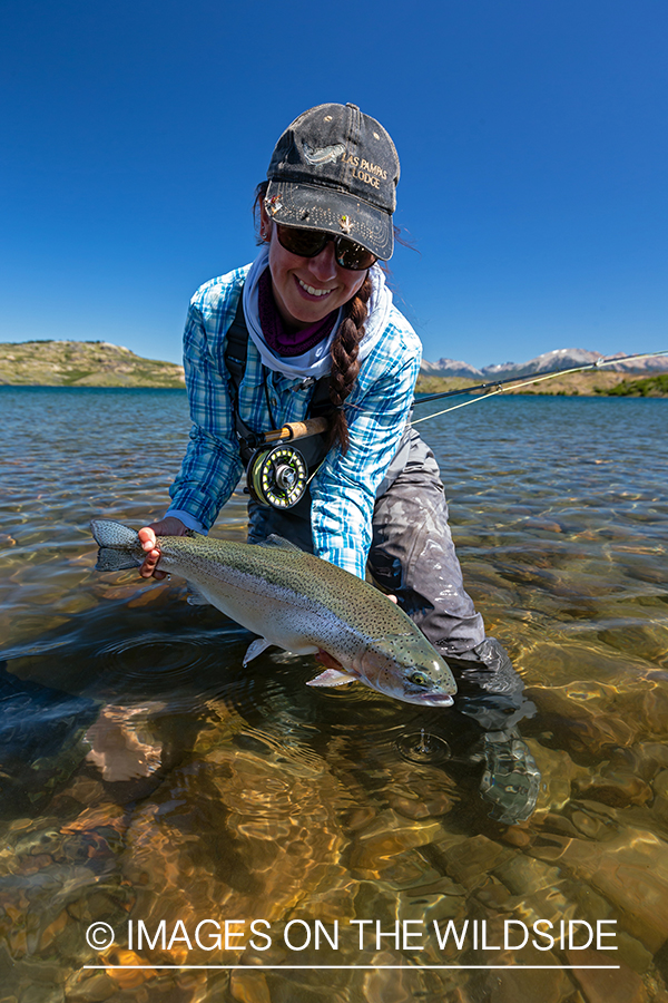 Woman fly fishing guide(Marcela Appelhanz) on stream.