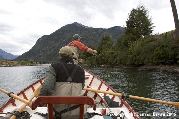 Flyfisherman casting from driftboat.