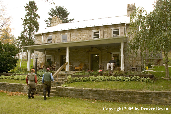 Flyfishermen walking from spring creek to club house porch.