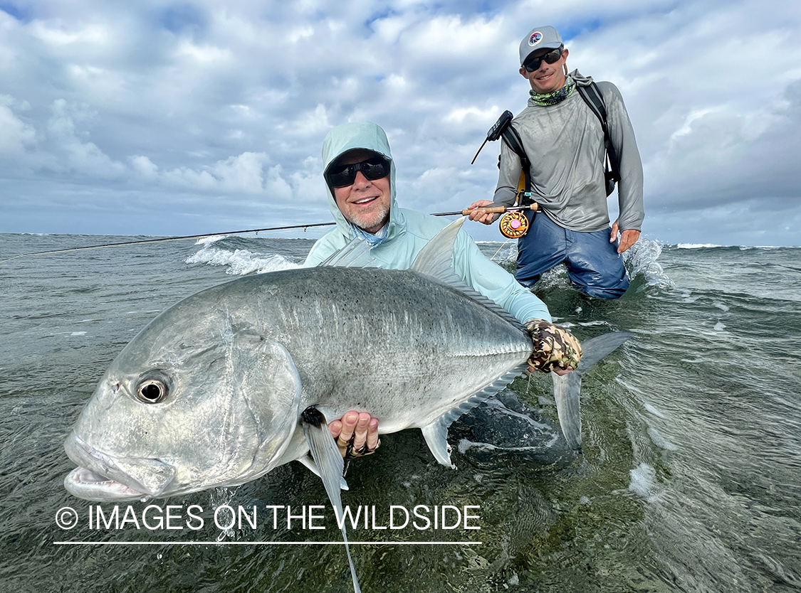 Flyfisherman with giant trevally.