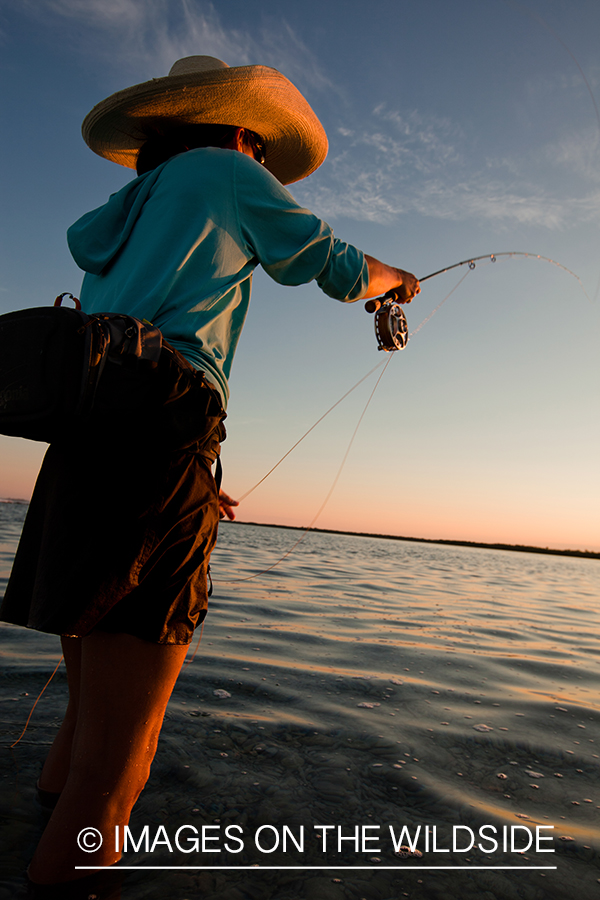 Flyfishing woman in flats.