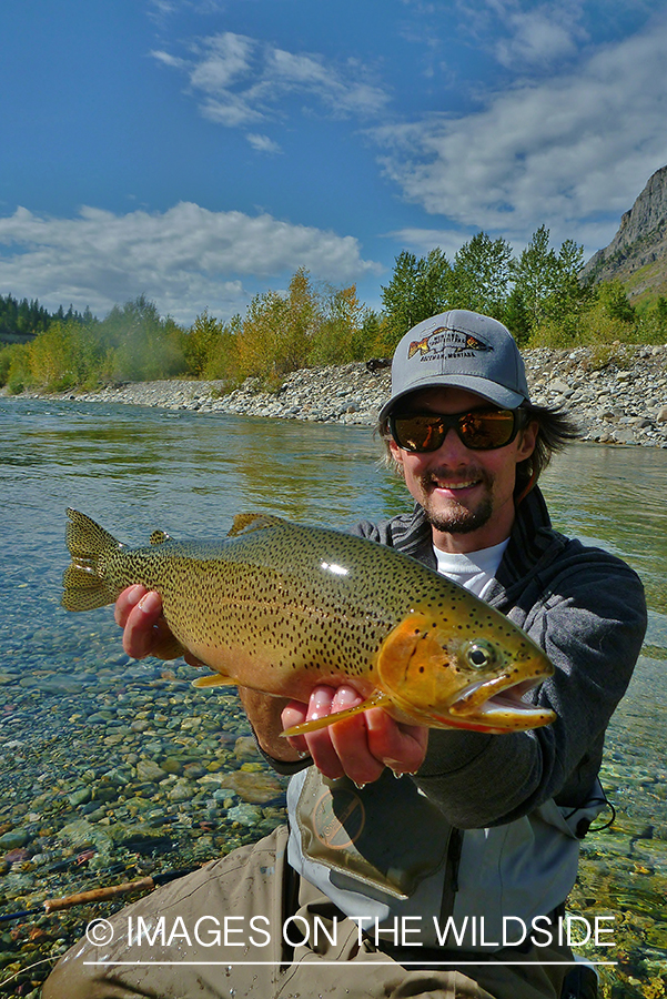 Flyfisherman with brown trout.