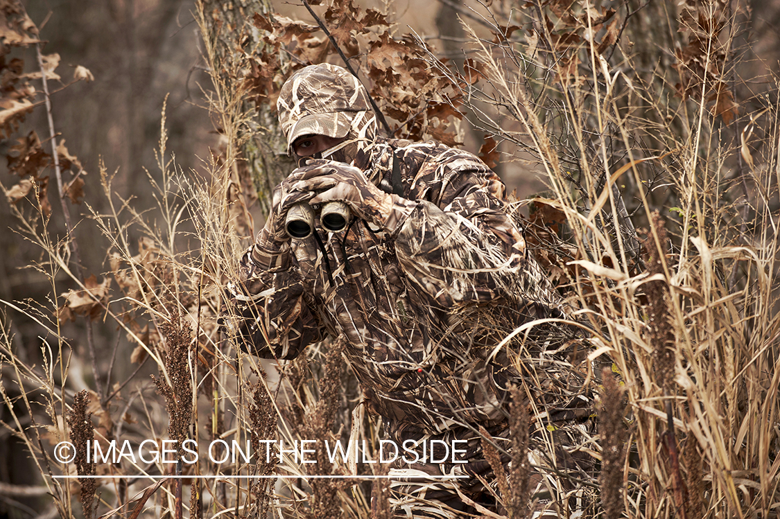 Waterfowl hunter scanning for fowl.