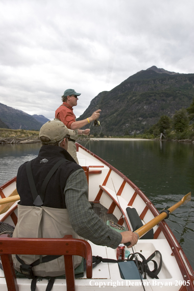 Flyfisherman casting from driftboat.