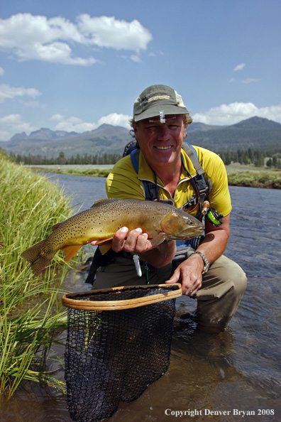 Flyfisherman with cutthroat trout