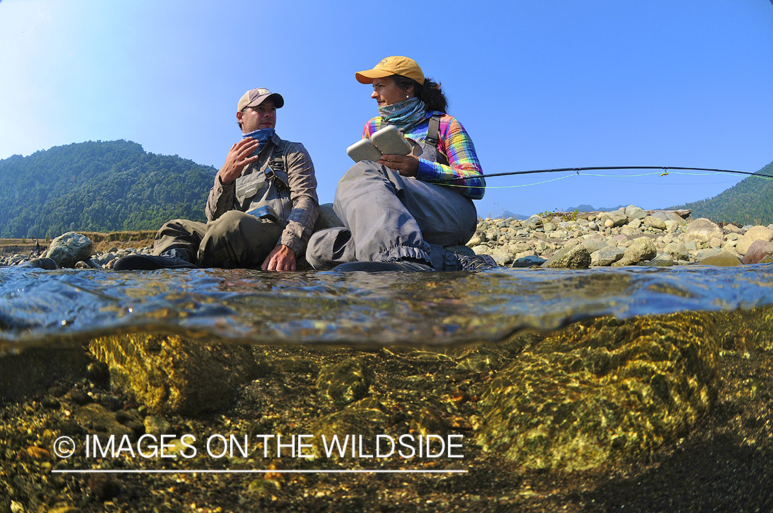 Flyfishermen on river in Chile.