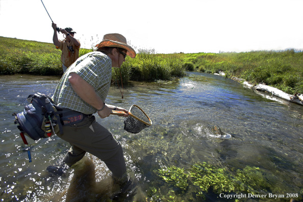 Flyfisherman fishing stream 