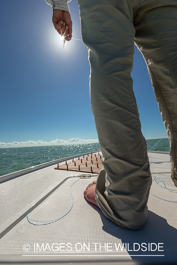 Flyfisherman on boat.